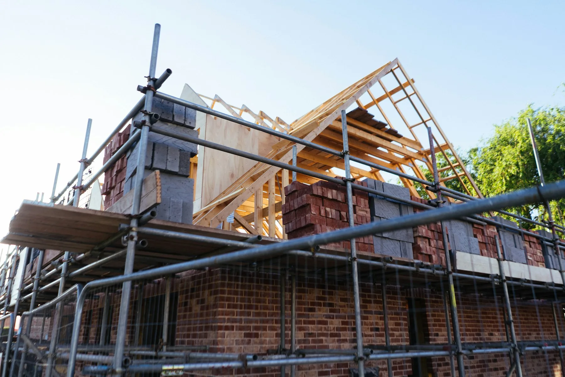 A brick house being built